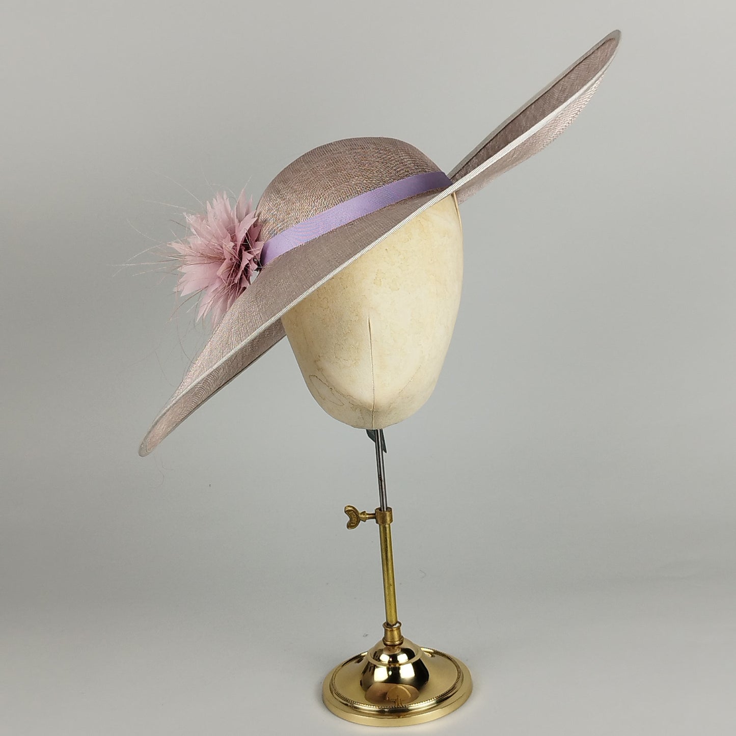 Lilac wedding hat with feather flower and silk band. Elegant and romantic for weddings, Royal Ascot, and special occasions.