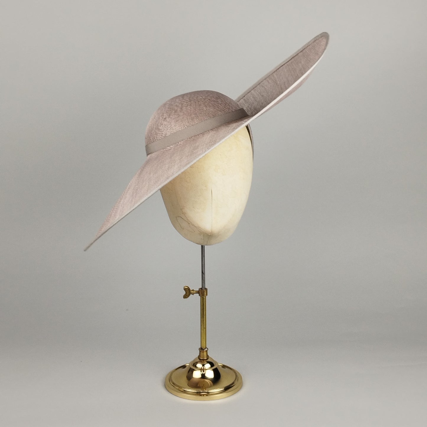 Asymmetric Lavender Silver Pearl -toned occasion hat with sculptural silhouette