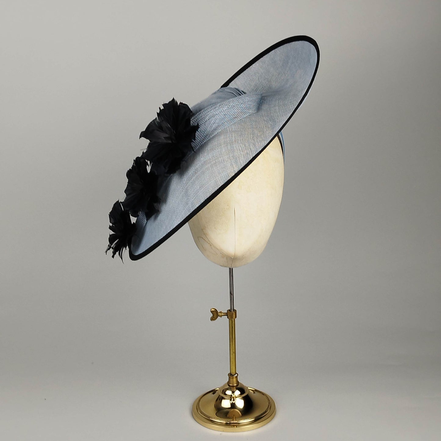 Cornflower blue fascinator with black feather flowers