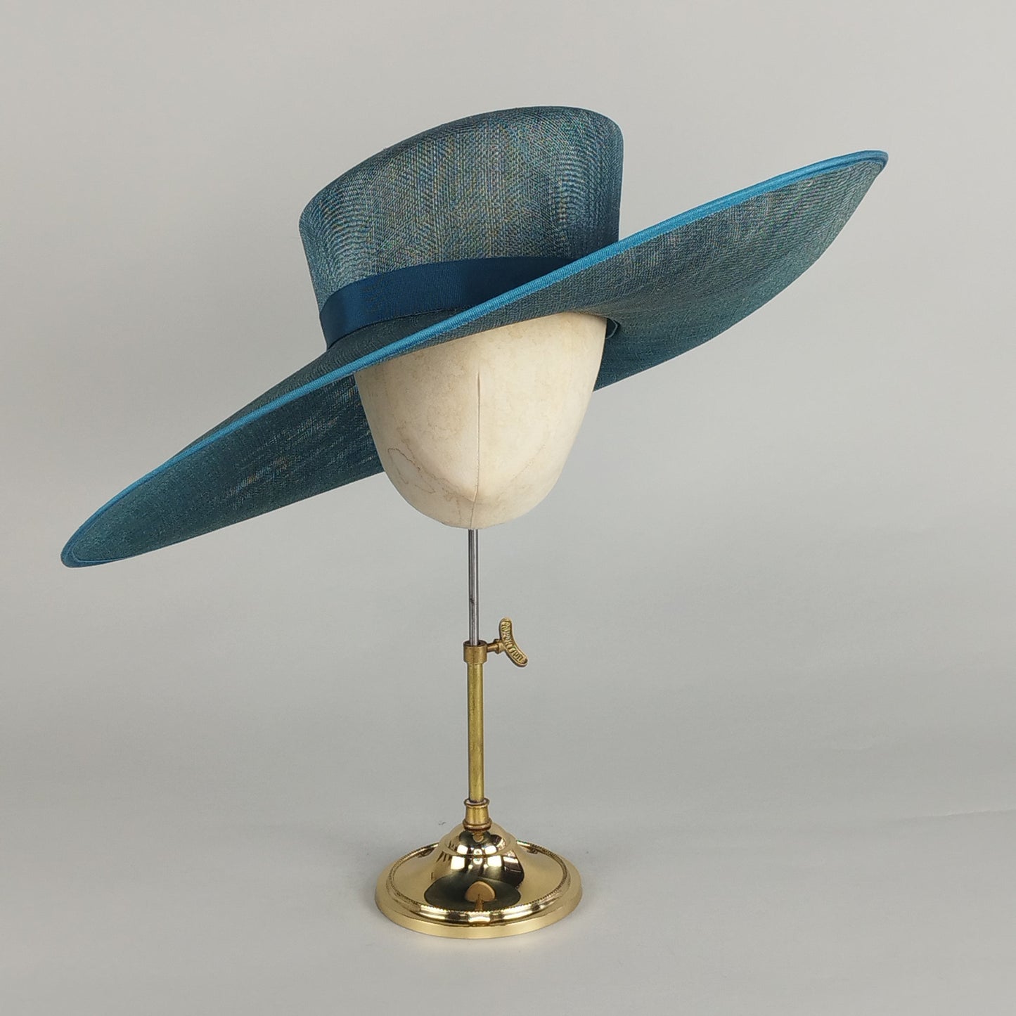 Formal peacock teal hat with wide brim and minimal design, perfect teal hat for weddings, race days, and elegant events.