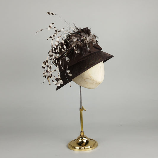Chocolate brown ladies formal hat with feather accent, perfect for weddings and formal occasions.