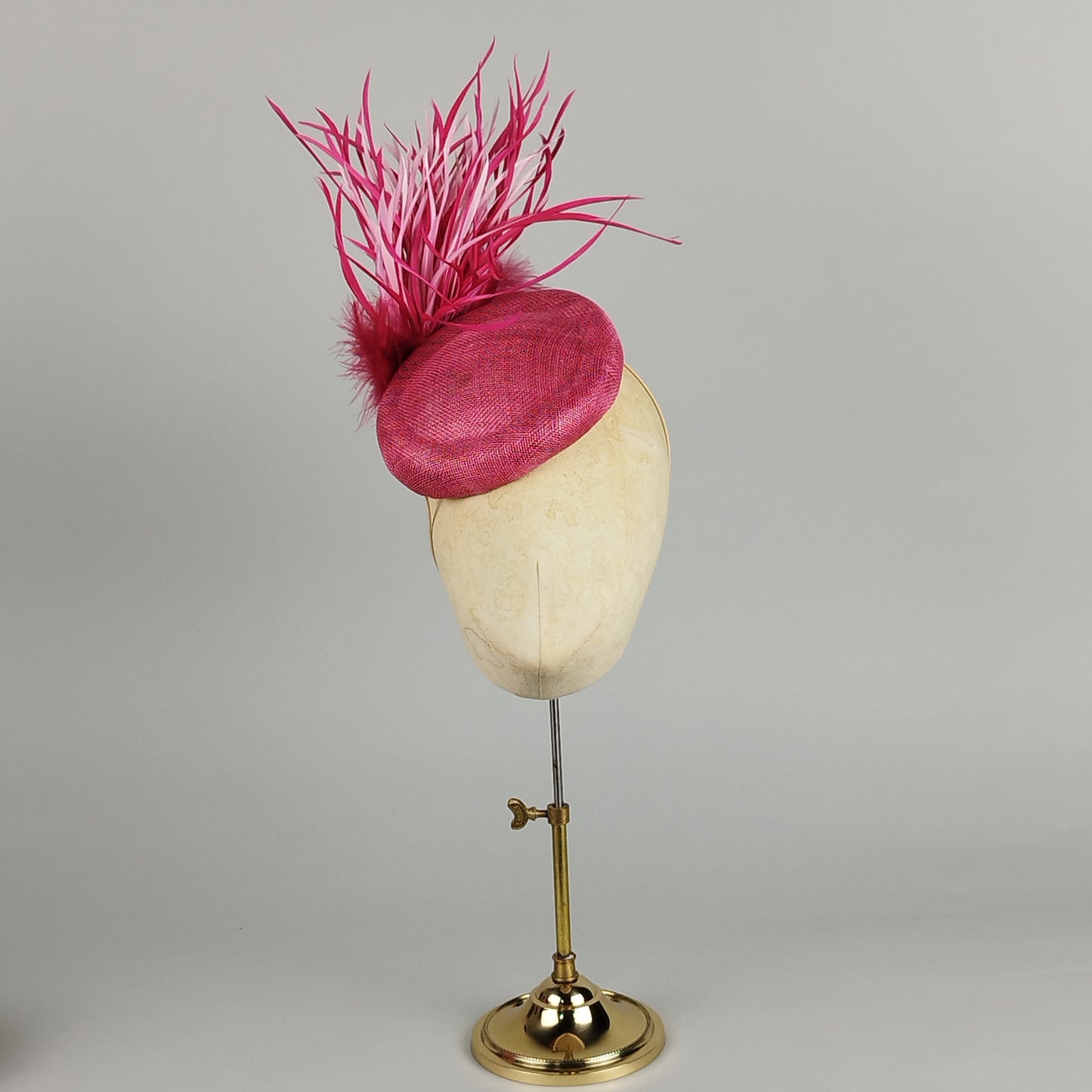 Hot pink pillbox hat with dramatic feather spray - bold statement occasion hat