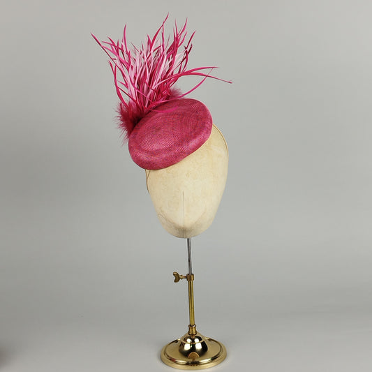 Hot pink pillbox hat with dramatic feather spray - bold statement occasion hat