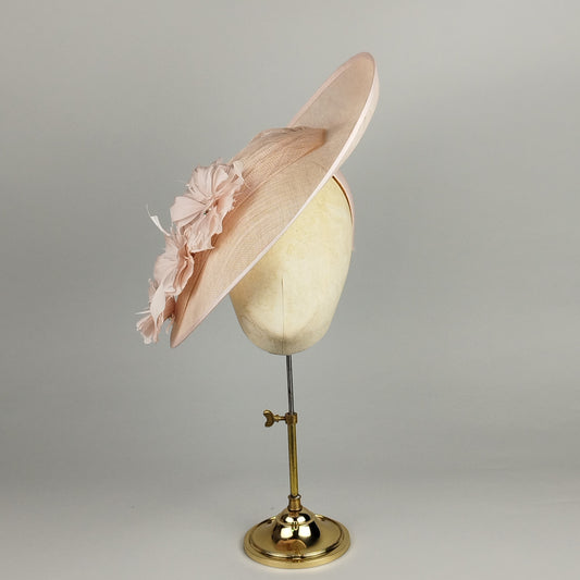 Pale soft pink hatinator with feather flowers and diamante centres – perfect for weddings and Royal Ascot.