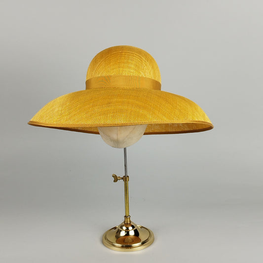 Sunflower yellow Dior-style hat with a deep crown and wide brim, perfect for weddings and Royal Ascot.
