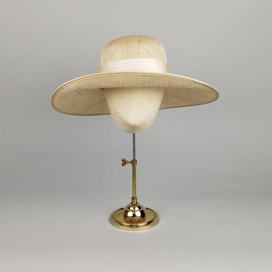 Cream summer cloche hat with structured ivory bow detail for weddings and special occasions