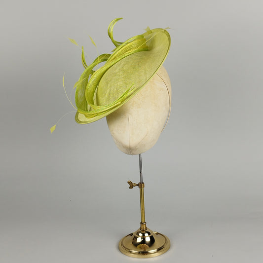Fresh lime green and lemon yellow hatinator with sinamay swirls and feather accents, perfect for weddings and special occasions