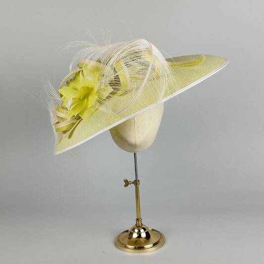 Bold lime yellow wide-brim hat with feathers, feather flowers, and pearl-like dots, perfect for weddings and Royal Ascot.