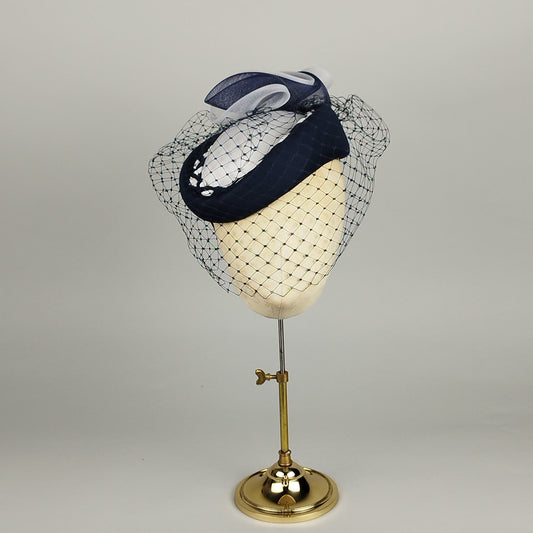 Navy and White pillbox hat with birdcage veil.