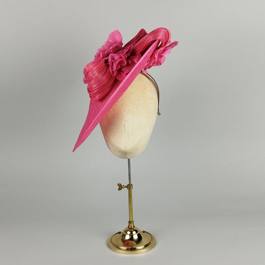 Hot pink hatinator with sculptural swirls and floral detail - contemporary wedding guest hat design