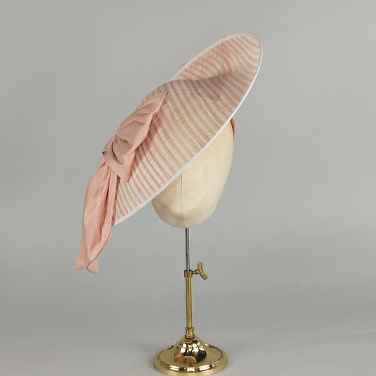 Large ivory hatinator with coral pink stripes and apricot silk bows, perfect for Bridgerton-inspired weddings or garden parties.