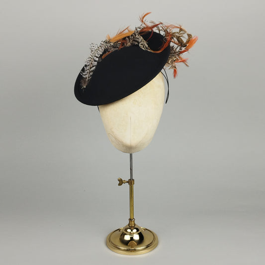Black winter hatinator with curved pheasant feather detail