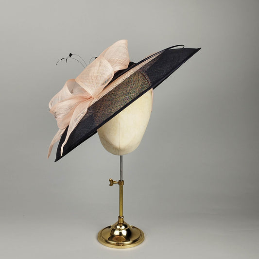 Navy and pink side-sweep hatinator with windowpane sinamay detail and dramatic blush bow
